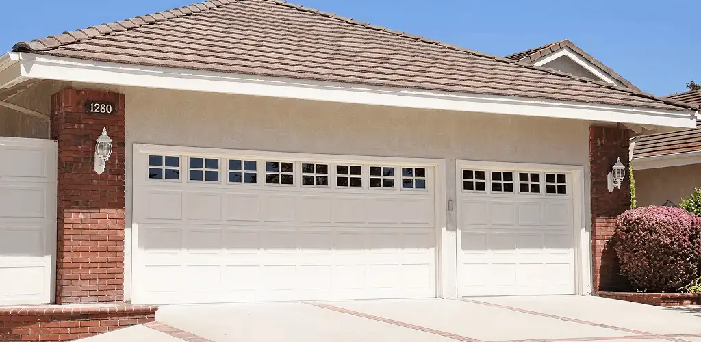 Residential garage door repair service for a double garage door in Fort Collins, CO