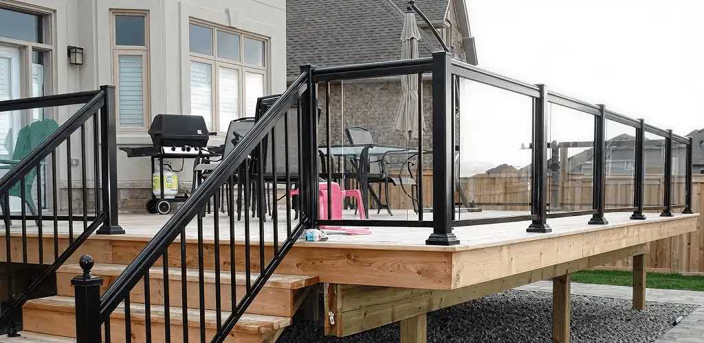 Handrail installation on a deck staircase for safety and code compliance in Fort Collins, CO